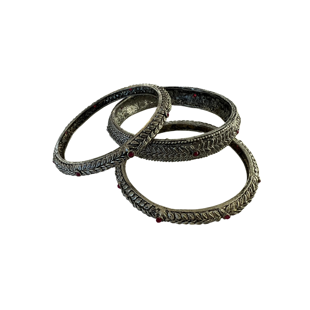 silver bangles with magenta gems